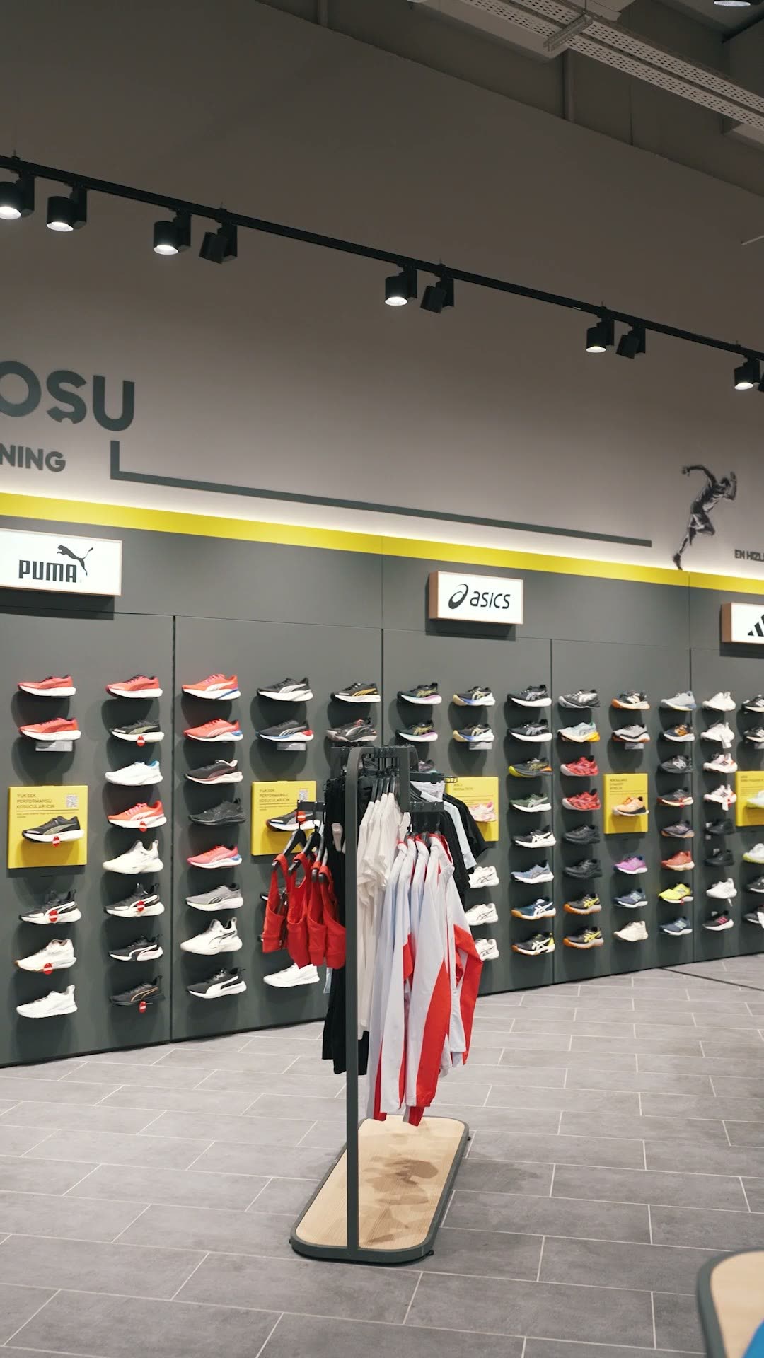 Sportswear store interior, a wall of running shoes